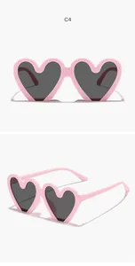 Vistas frontal y lateral de gafas de sol infantiles rosas con forma de corazón y lentes oscuras