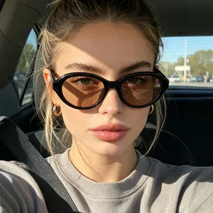 Chic retro oval frame sunglasses for women featuring black frames and brown lenses