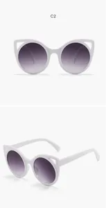 Adorable white cat-ear children's sunglasses with purple gradient lenses from two angles