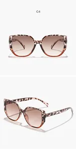 Stylish square frame sunglasses featuring leopard pattern and brown gradient lenses