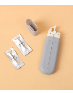 Detail view of a grey portable folding hanger with two osmanthus fragrance tablets