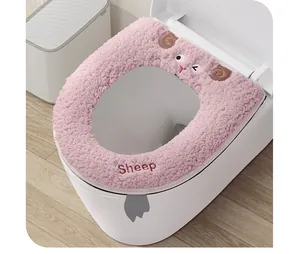 Detail view of pink plush thickened toilet seat cover with cute cartoon sheep embroidery