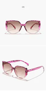 Detailed view of stylish pink patterned square sunglasses with gradient brown lenses