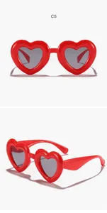 Stylish red heart-shaped sunglasses for kids shown in both front and angled detail views