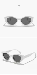 Two-angle view of white retro cat eye sunglasses with irregular frames