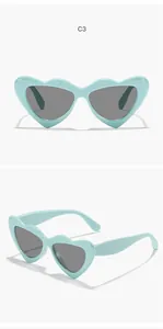Detail views of light blue heart-shaped sunglasses for kids with dark grey lenses