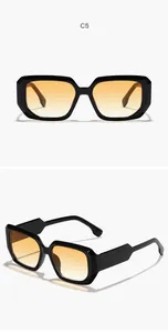 Detailed view of classic square sunglasses with black frame and orange gradient lenses