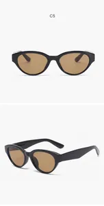 Gedetailleerde weergave van vintage cat-eye zonnebril met zwart montuur en bruine glazen