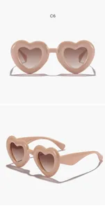 Detailed multi-angle views of kids heart-shaped retro sunglasses in a dusty rose finish