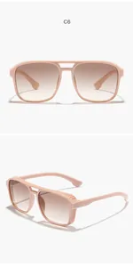 Detailed view of peach steampunk sunglasses with gradient brown lenses.