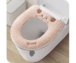 Close-up of thick plush pink sheep-themed toilet seat cover in a bathroom
