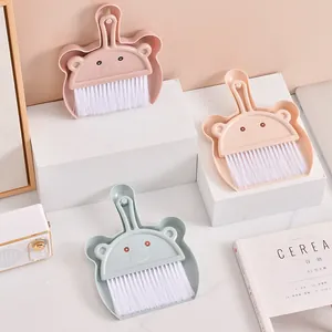 Cute bear-shaped desktop dustpan and brush set for keyboard and home cleaning.