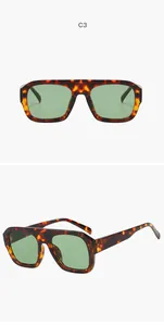 Close-up detail of trendy tortoise shell square aviator sunglasses with green lenses