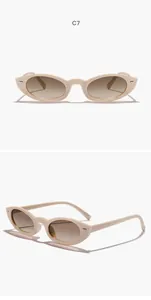 Λεπτομερής όψη vintage γυαλιών ηλίου cat-eye με μπεζ σκελετό και καφέ φακούς διαβάθμισης