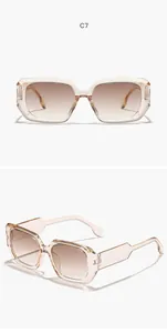 Close-up detail of champagne transparent square frame sunglasses with gradient lenses