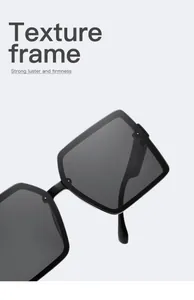 Close-up detail of oversized black square frame sunglasses with a textured finish.