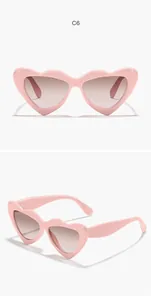Front and side views of pink heart-shaped children's sunglasses for outdoors.