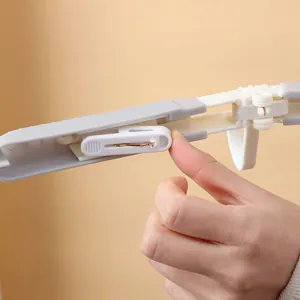 Detail view of portable folding travel hanger mechanism for compact storage and organization