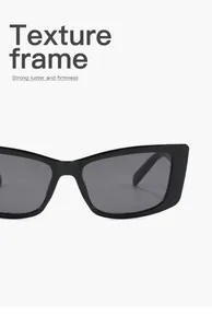 Λεπτομέρεια από μαύρα ρετρό γυαλιά ηλίου cat-eye με ανθεκτικό σκελετό υφής