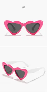 Heart-shaped children's sunglasses featuring pink candy frames and white temples details