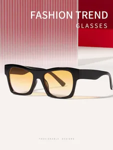 Close-up of retro square sunglasses with orange gradient lenses for fashion streetwear