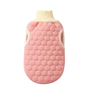 Pink honeycomb exfoliating bath glove with soft elastic wrist cuff for shower massage.