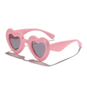 Stylish pink heart-shaped sunglasses for kids with UV protection and retro design.