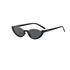 Stylish women's cat-eye semi-rimless sunglasses with gold accents in street style