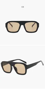 Detailed view of black square frame aviator sunglasses with tan lenses.