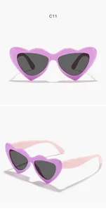 Detailed views of purple heart-shaped sunglasses for kids with pink temples