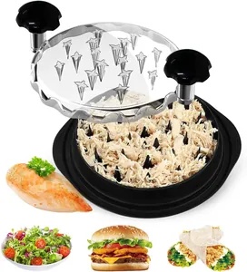 Close-up of chicken shredder tool with shredded meat for salad, burgers and wraps