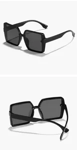 Detailed product view showing front and back angles of oversized black square sunglasses
