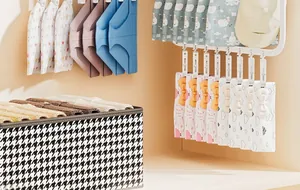 Detail view of wall-mounted multi-clip sock drying rack for efficient home laundry organization