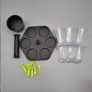 Détails des composants du distributeur de 6 verres avec gobelets et buses vertes.