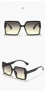 Detailed view of fashionable oversized square sunglasses featuring elegant gradient lenses.