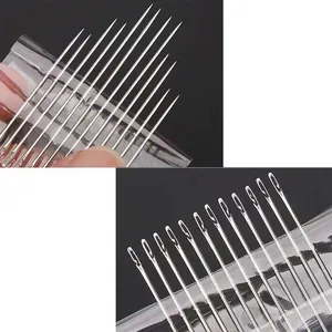 Détail macro d'aiguilles à coudre à enfilage automatique avec pointes acérées pour couture.