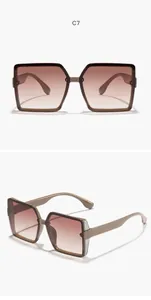 Detailed view of oversized square sunglasses with gradient lenses and glitter accents.