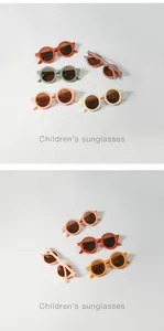 Various colorful round children's sunglasses displayed on a clean white background