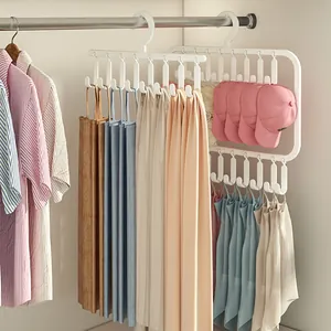 Detail of multi-functional white storage hanger holding camisoles and caps in wardrobe