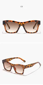 Detailed view of retro square sunglasses with leopard print frames and gradient lenses