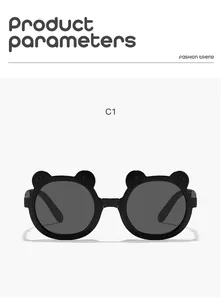 Close-up of black children's sunglasses featuring cute cartoon bear-ear frames.
