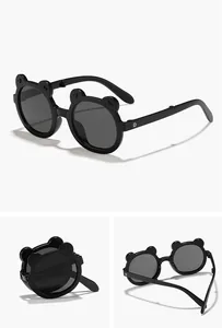 Detailed view of cute black bear-shaped folding sunglasses for kids with round lenses