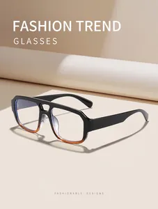 Detail showing the stylish double-bridge and the unique black-to-brown gradient frame.