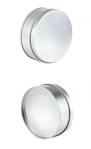 Side and top views of a minimalist silver circular aluminum jewelry storage box