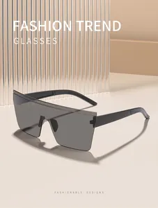 Detailed view of oversized rimless square shield sunglasses in dark grey