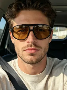 Close-up view of a man wearing stylish retro oversized double-bridge aviator sunglasses