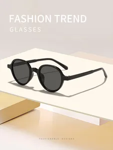 Detailed macro view of stylish lightweight black round frame sunglasses for sun protection