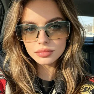 Close-up view of stylish retro rectangular sunglasses with unique gradient lenses worn by model