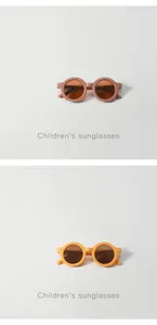 Two pairs of round frame retro children's sunglasses in terracotta and mustard yellow