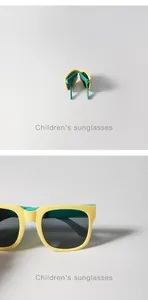 Foldable children's sunglasses in yellow and teal with protective dark grey lenses